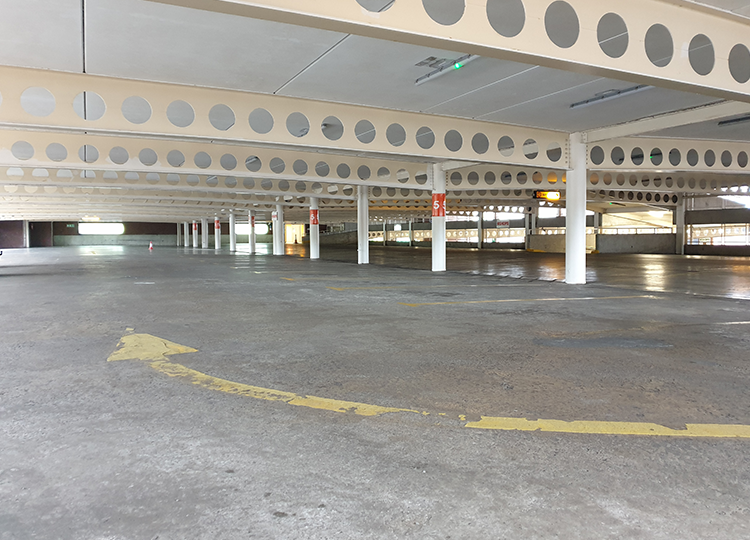 Triflex before image of Buttercrane Shopping Centre car park in Newry
