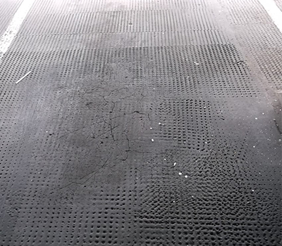 Image of contaminated asphalt on a car park